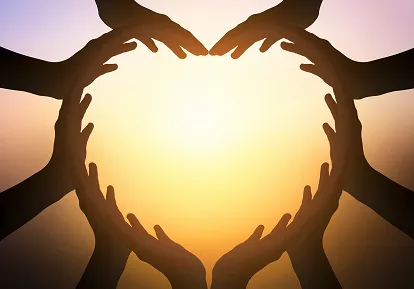 Hands held together — care and connection
